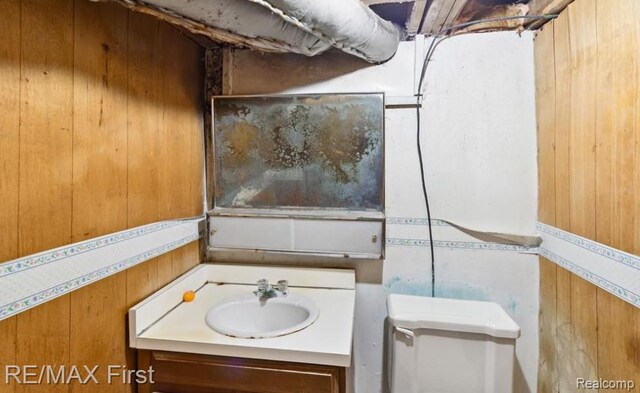 26914 Glendale, Redford, MI 48239 - bathroom with wood walls, toilet, and vanity