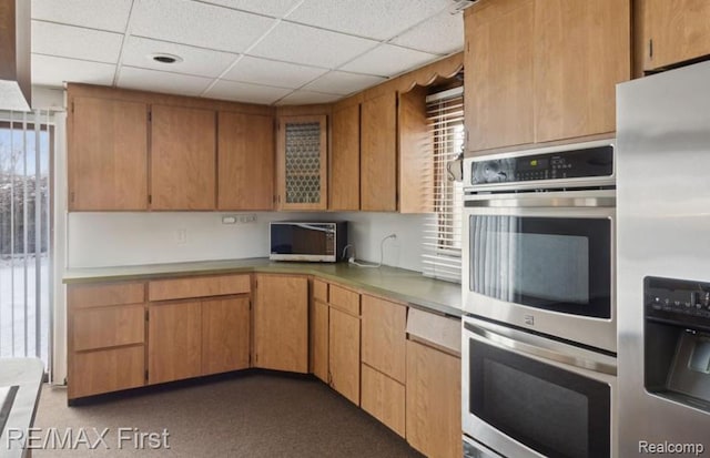 26914 Glendale, Redford, MI 48239 - kitchen featuring appliances with stainless steel finishes, healthy amount of natural light, a drop ceiling, and light countertops