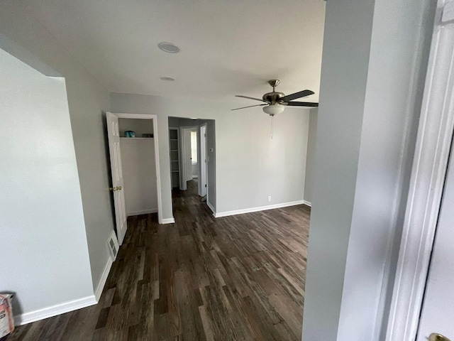 19943 Southfield Fwy, Detroit, MI 48235 - spare room featuring dark wood-style floors, a ceiling fan, and baseboards