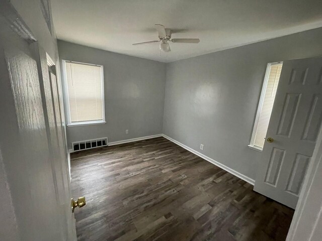 19943 Southfield Fwy, Detroit, MI 48235 - unfurnished bedroom with dark wood finished floors, baseboards, and ceiling fan