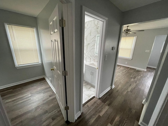 19943 Southfield Fwy, Detroit, MI 48235 - hall with dark wood-style floors and baseboards