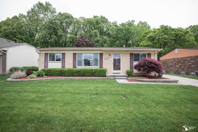 43800 Proctor Rd, Canton, MI 48188 - ranch-style home featuring brick siding and a front yard