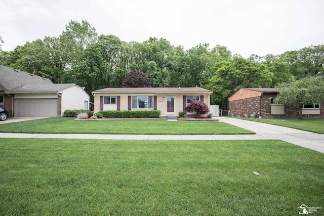 43800 Proctor Rd, Canton, MI 48188 - single story home featuring brick siding, a front yard, driveway, and an attached garage