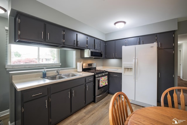 43800 Proctor Rd, Canton, MI 48188 - kitchen featuring appliances with stainless steel finishes, a sink, light wood-style flooring, and light countertops