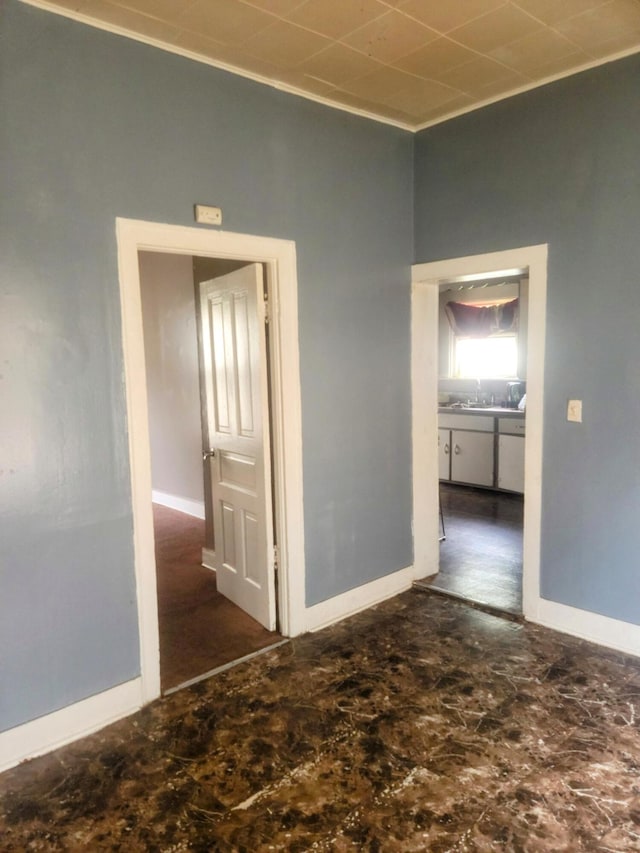 427 Highland St SE, Grand Rapids, MI 49507 - spare room with baseboards and a sink