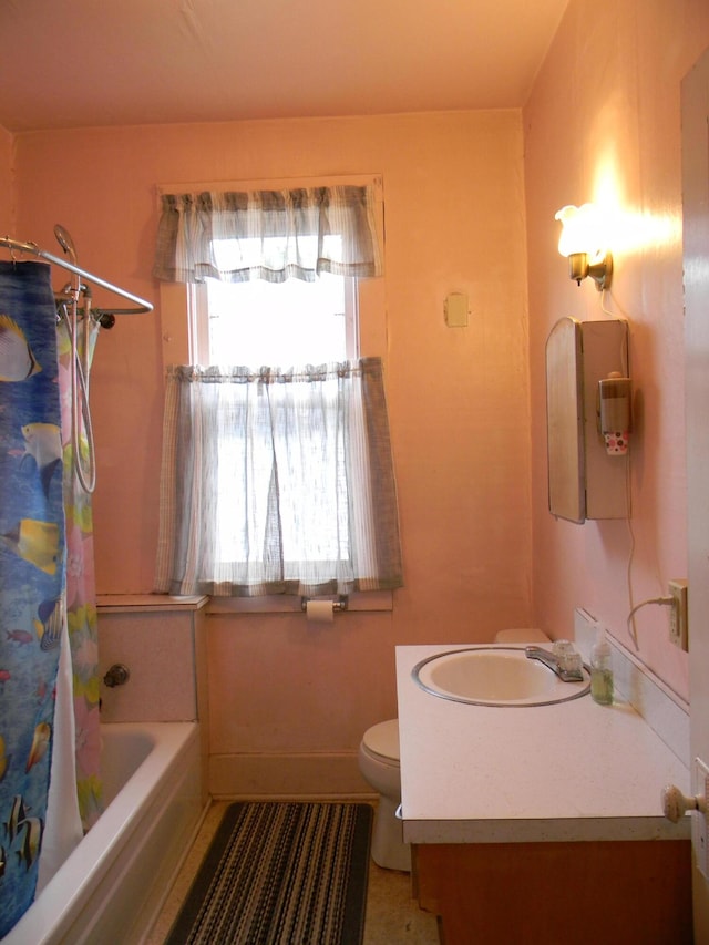 306 N Rowe St, Ludington, MI 49431 - full bathroom with vanity, toilet, and shower / bath combo