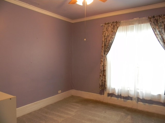 306 N Rowe St, Ludington, MI 49431 - carpeted spare room with a ceiling fan, ornamental molding, and baseboards