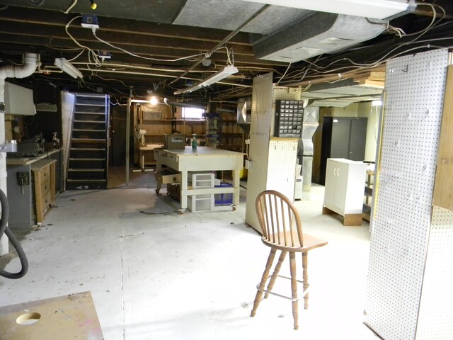 306 N Rowe St, Ludington, MI 49431 - unfinished basement with stairs