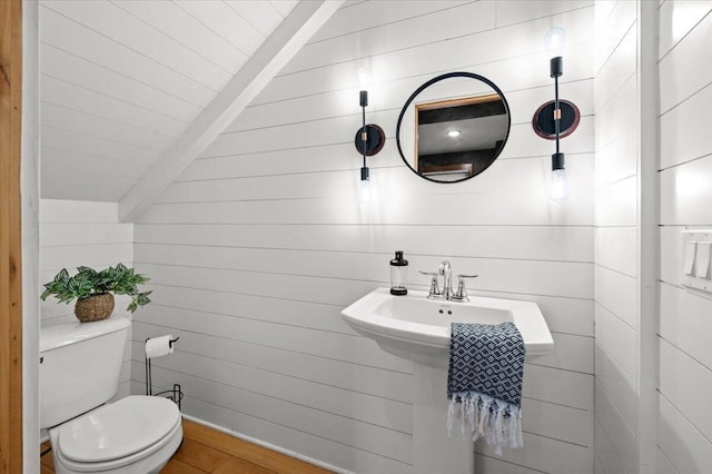 152 National Ave SW, Grand Rapids, MI 49504 - half bath featuring toilet, wood walls, and beamed ceiling