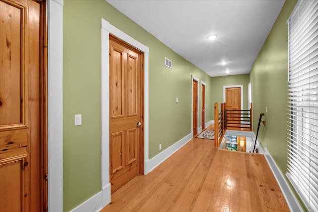 152 National Ave SW, Grand Rapids, MI 49504 - corridor featuring an upstairs landing, light wood finished floors, baseboards, and recessed lighting