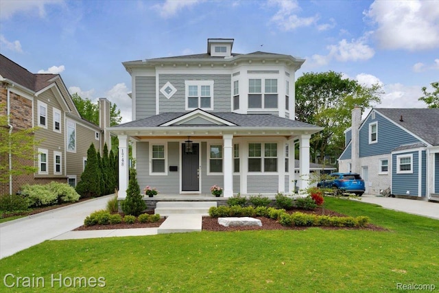 1748 Stanley Blvd, Birmingham, MI 48009 - italianate house featuring a porch and a front yard