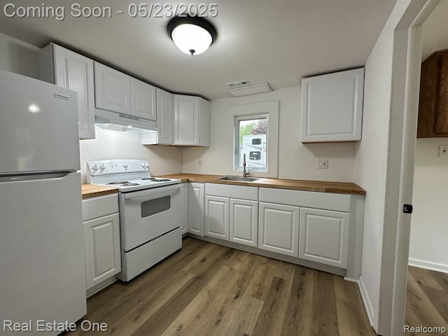 5399 Brobeck St, Flint, MI 48532 - kitchen with electric range, freestanding refrigerator, under cabinet range hood, and wood counters
