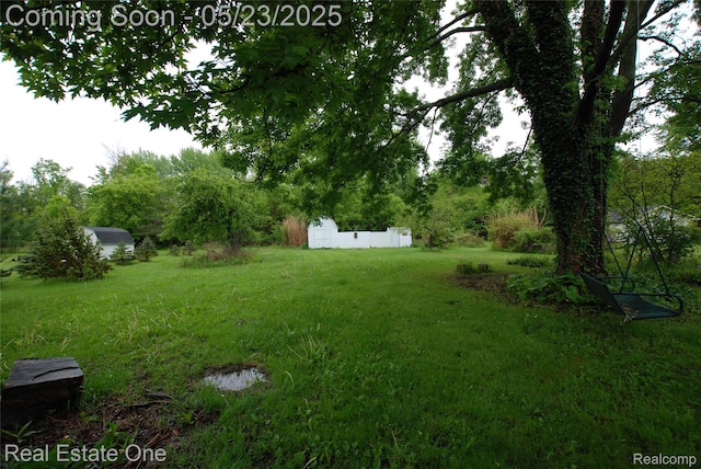 5399 Brobeck St, Flint, MI 48532 - view of green lawn featuring a shed