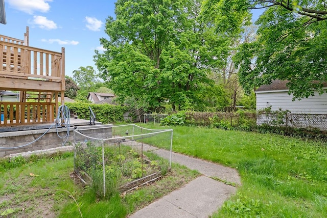 612 E 3rd St, Flint, MI 48503 - view of yard featuring a deck