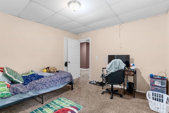 612 E 3rd St, Flint, MI 48503 - bedroom with a paneled ceiling, carpet, and baseboards
