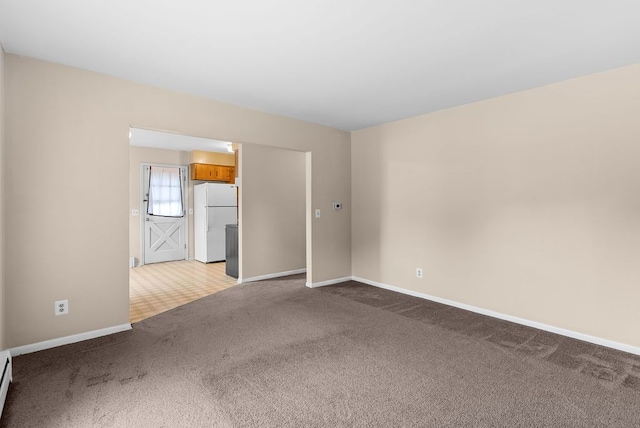 612 E 3rd St, Flint, MI 48503 - carpeted spare room with a baseboard radiator and baseboards