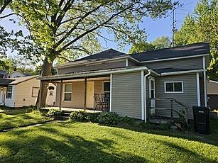 185 E Commerce St, Grant, MI 49327 - back of house with a lawn and covered porch