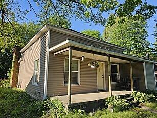 185 E Commerce St, Grant, MI 49327 - view of property exterior with a porch