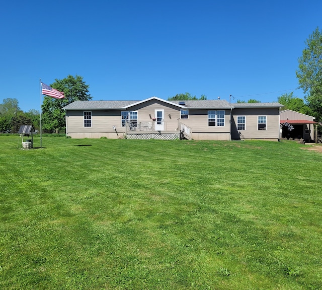 4908 Brookfield Rd, Charlotte, MI 48813 - rear view of house with a wooden deck and a yard