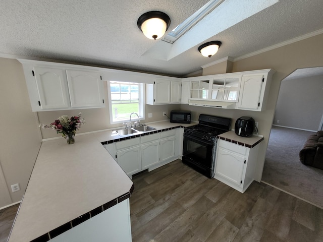 4908 Brookfield Rd, Charlotte, MI 48813 - kitchen featuring black appliances, a sink, a textured ceiling, white cabinetry, and lofted ceiling
