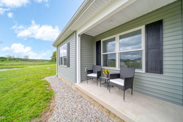 5726 Joshua Dr, Eaton Rapids, MI 48827 - view of patio featuring a water view