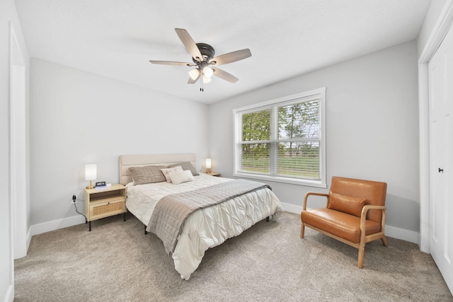 5726 Joshua Dr, Eaton Rapids, MI 48827 - carpeted bedroom with baseboards, a closet, and a ceiling fan