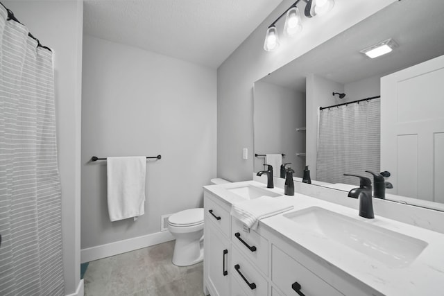 5726 Joshua Dr, Eaton Rapids, MI 48827 - bathroom featuring toilet, baseboards, double vanity, a shower with shower curtain, and a textured ceiling