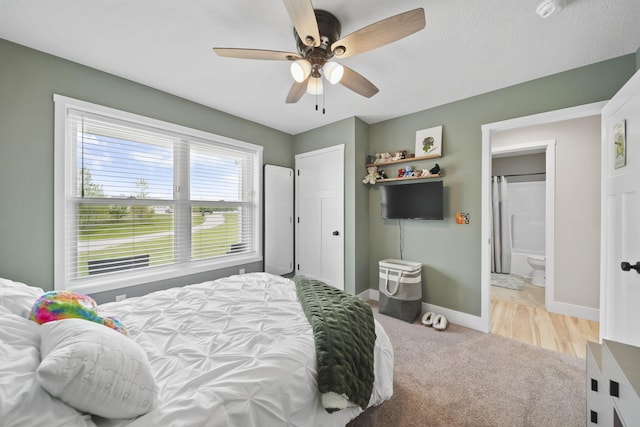 5726 Joshua Dr, Eaton Rapids, MI 48827 - bedroom with baseboards, light colored carpet, and ceiling fan