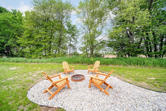 5726 Joshua Dr, Eaton Rapids, MI 48827 - view of yard featuring a fire pit