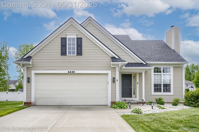 4422 Jordan Dr, Grand Blanc, MI 48439 - traditional-style house with driveway, a garage, a chimney, and a shingled roof