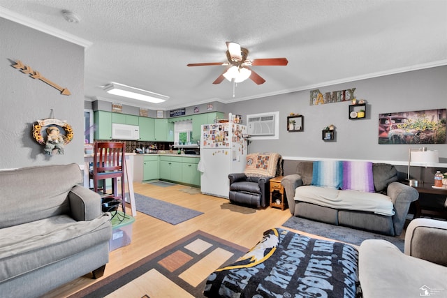 12323 Oakland Ave, Mount Morris, MI 48458 - living area featuring crown molding, a ceiling fan, light wood-type flooring, and a textured ceiling