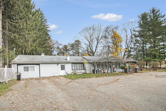 4491 S Jackson Rd, Jackson, MI 49201 - ranch-style house featuring a chimney