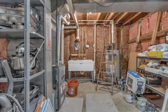 3460 Sears Rd, Horton, MI 49246 - utilities with gas water heater and a sink