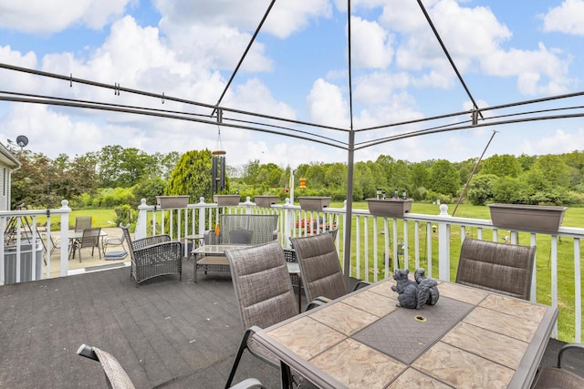3460 Sears Rd, Horton, MI 49246 - view of patio / terrace featuring outdoor dining area and view of wooded area