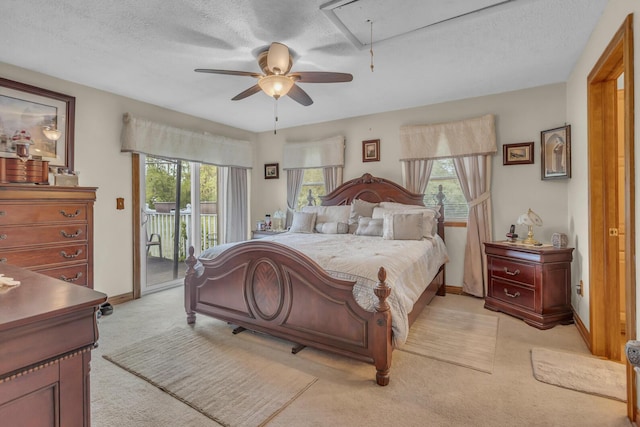3460 Sears Rd, Horton, MI 49246 - bedroom featuring attic access, access to exterior, light colored carpet, baseboards, and ceiling fan