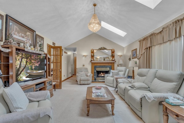 3460 Sears Rd, Horton, MI 49246 - living room featuring a skylight, a premium fireplace, lofted ceiling, light carpet, and a chandelier