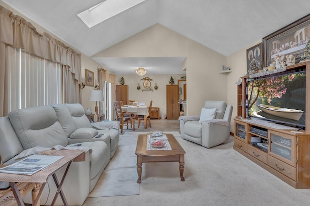 3460 Sears Rd, Horton, MI 49246 - living room featuring a skylight, vaulted ceiling, and light colored carpet