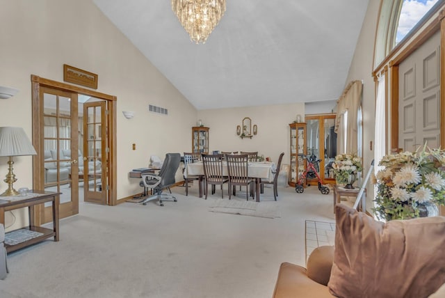 3460 Sears Rd, Horton, MI 49246 - carpeted office featuring french doors, high vaulted ceiling, a chandelier, and healthy amount of natural light