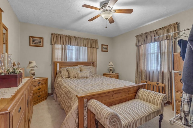 3460 Sears Rd, Horton, MI 49246 - bedroom featuring light carpet, a textured ceiling, and a ceiling fan