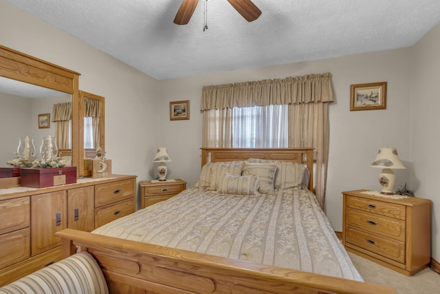 3460 Sears Rd, Horton, MI 49246 - bedroom featuring a textured ceiling, light colored carpet, and ceiling fan