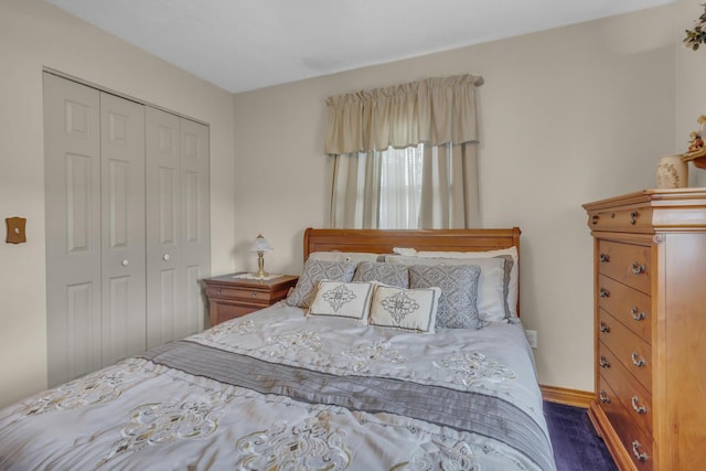 3460 Sears Rd, Horton, MI 49246 - bedroom with a closet, wood finished floors, and baseboards