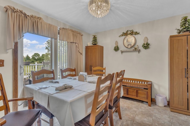 3460 Sears Rd, Horton, MI 49246 - dining area with a chandelier and light tile patterned floors