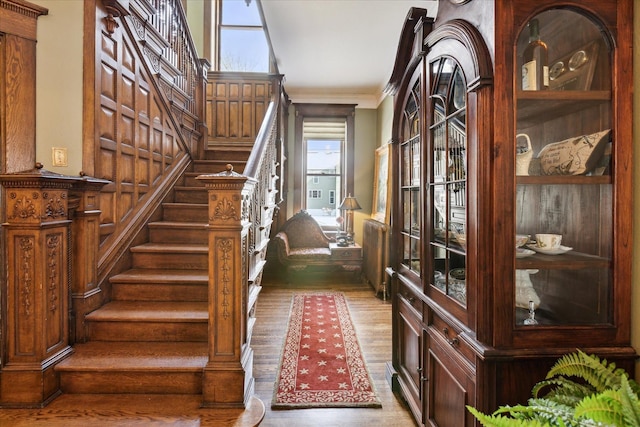303 S State Ave, Alpena, MI 49707 - stairway featuring wood finished floors and ornamental molding