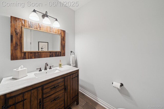 1992 Shipman Blvd, Birmingham, MI 48009 - bathroom featuring wood finished floors, vanity, and baseboards
