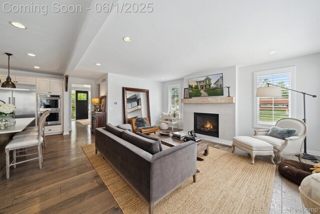 1992 Shipman Blvd, Birmingham, MI 48009 - living room with dark wood finished floors, healthy amount of natural light, recessed lighting, and a lit fireplace