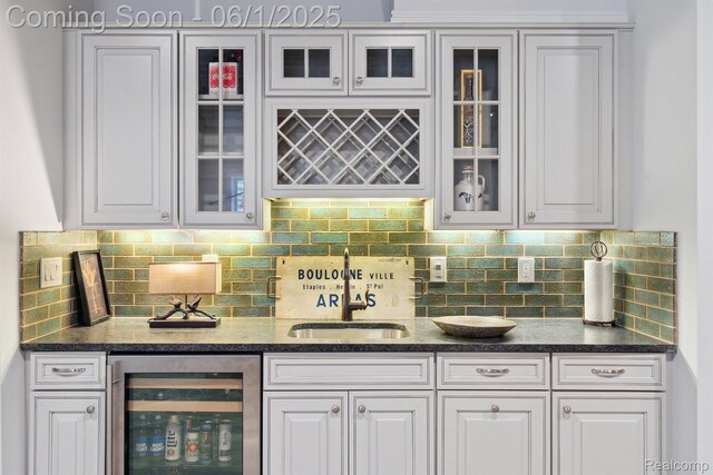 1992 Shipman Blvd, Birmingham, MI 48009 - indoor wet bar featuring wine cooler and backsplash