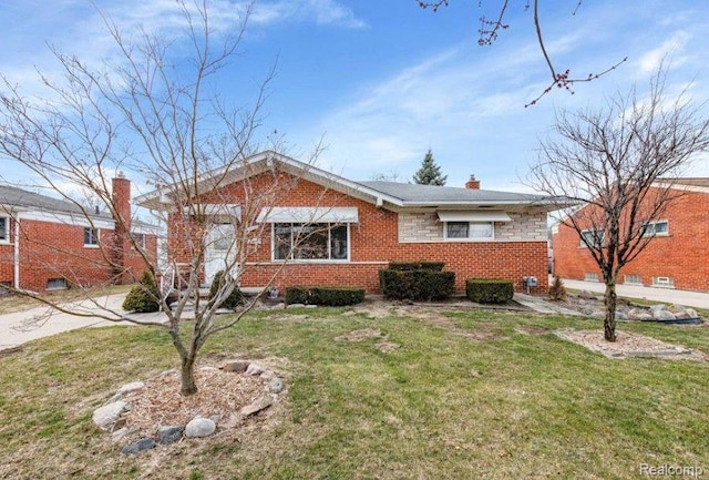 24223 Loretta Ave, Warren, MI 48091 - view of front of home with a front lawn, brick siding, and a chimney