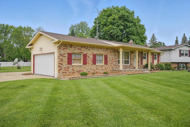 1451 Peachwood Dr, Flint, MI 48507 - view of front facade featuring brick siding, driveway, a front lawn, a garage, and a chimney