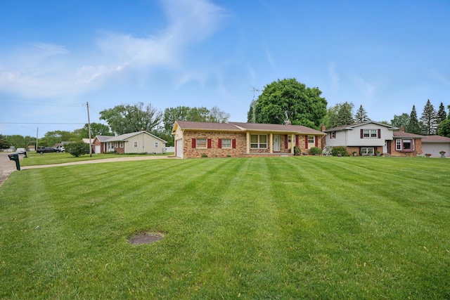 1451 Peachwood Dr, Flint, MI 48507 - view of front of house featuring a front yard and brick siding