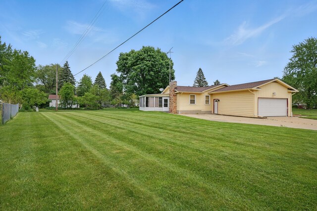 1451 Peachwood Dr, Flint, MI 48507 - view of green lawn with a sunroom